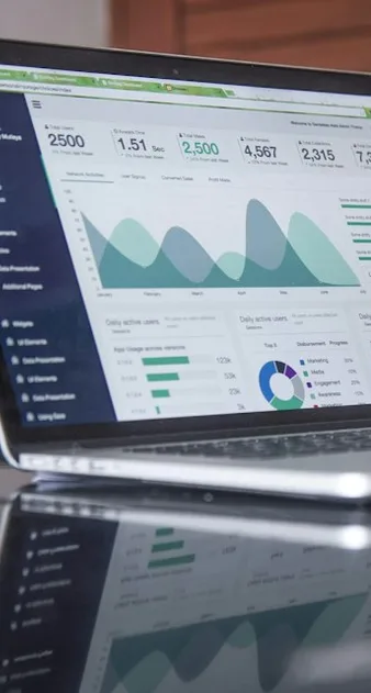 An analytics dashboard with charts displayed on a laptop screen.